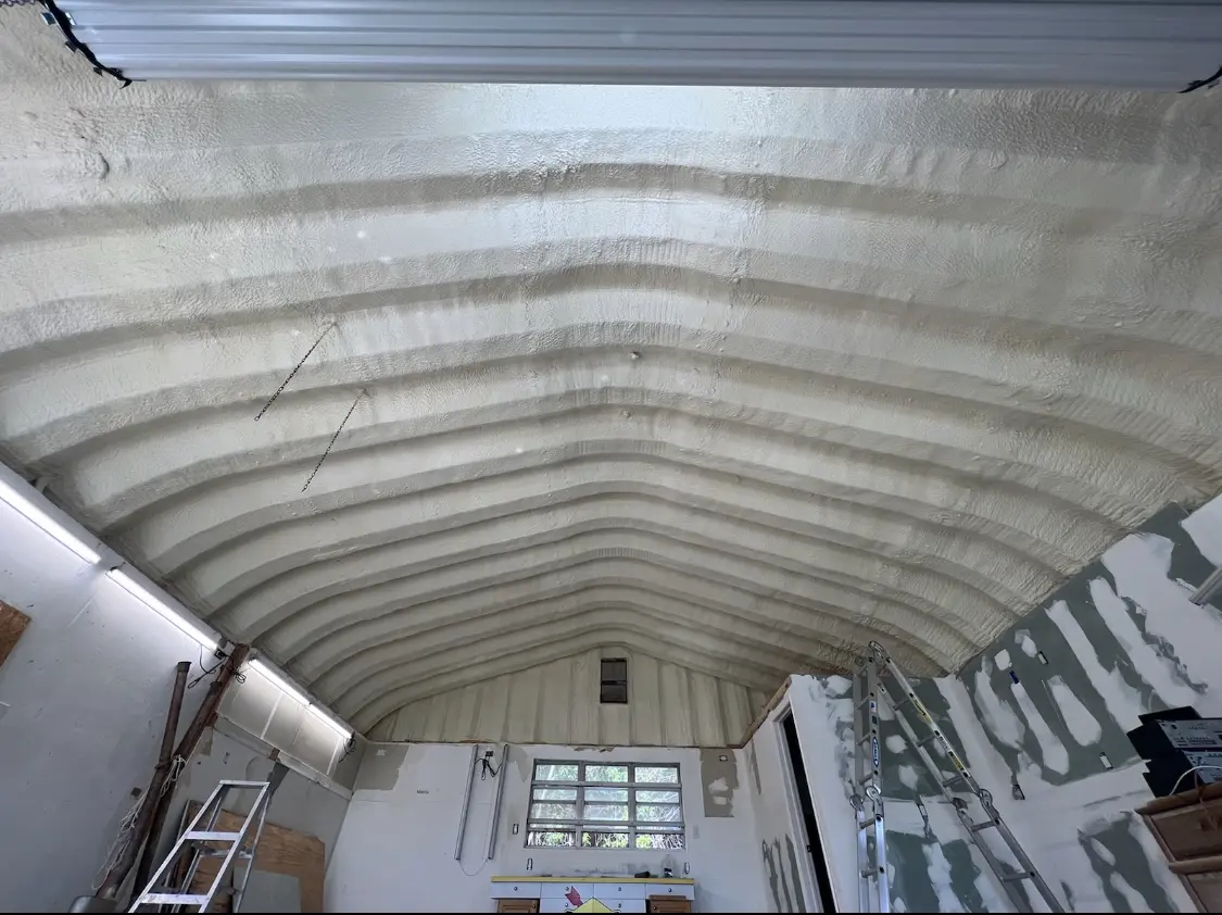 Spray polyurethane foam applied to the underside of a metal roof deck in Glendale Heights
